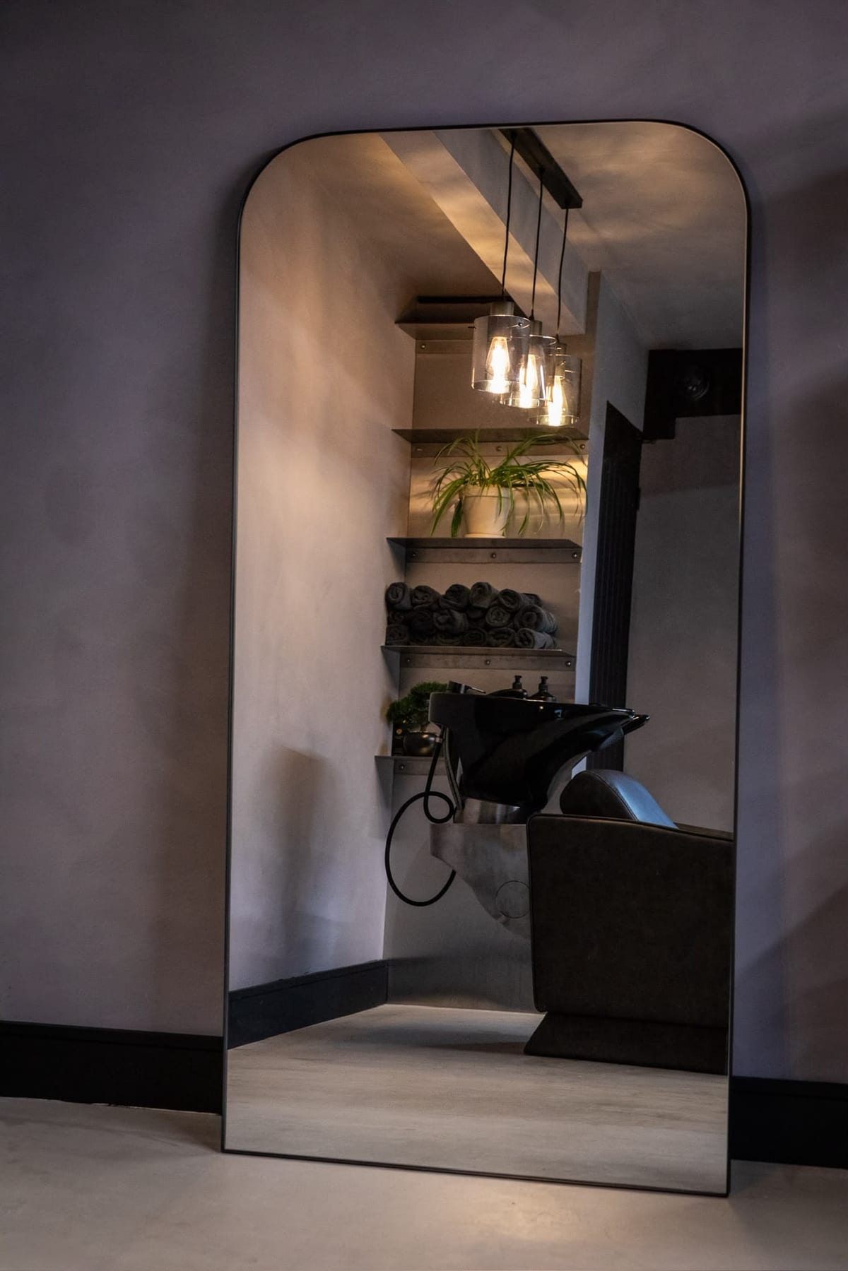 The wash area reflected in the full-length mirror at The P2 Collective