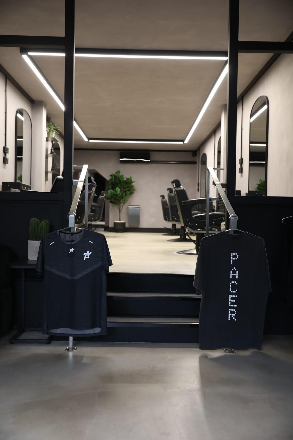 PACER running tees displayed inside The P2 Collective